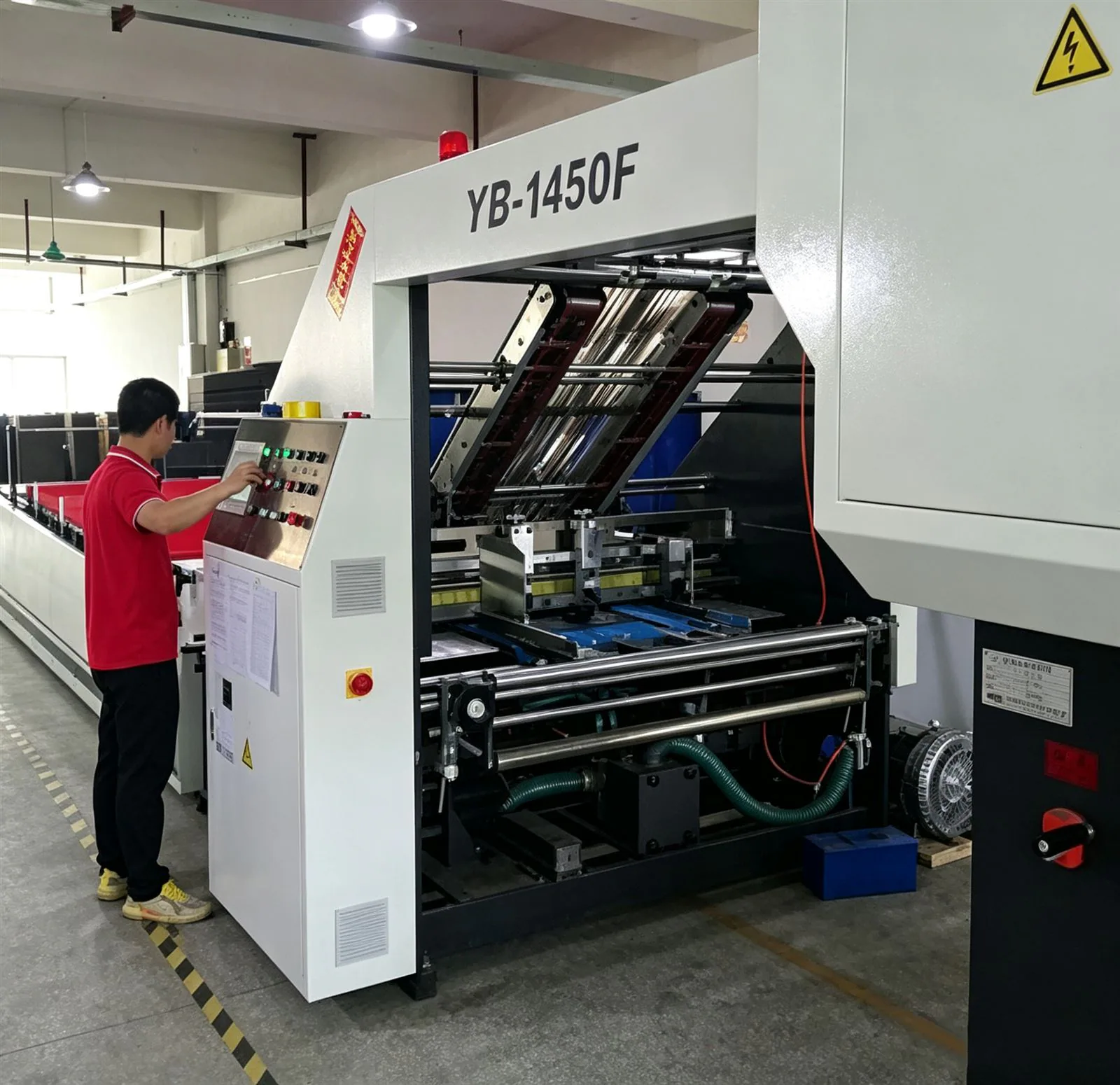 A folder-gluer operator on the finishing line, folding corrugated parts square and ready for assembly.