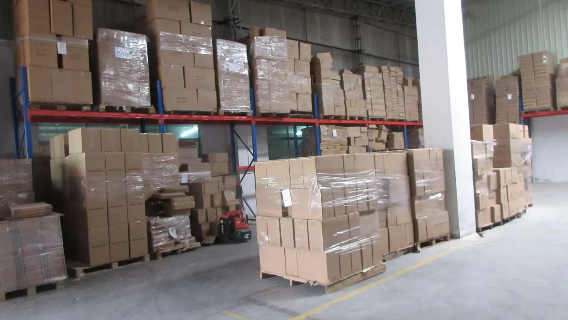 Wrapped export cartons on the racking, held off the floor and ready to pick for shipment.